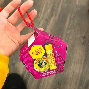 Burt bees lip balm set. It also comes with a hair tie .